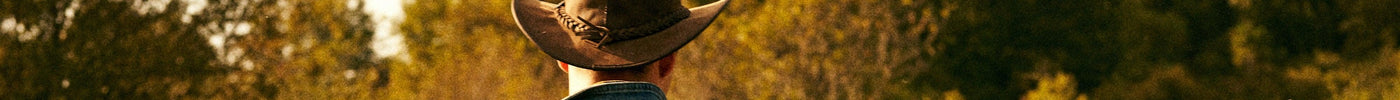 cowboy wearing a brown leather cowboy hat